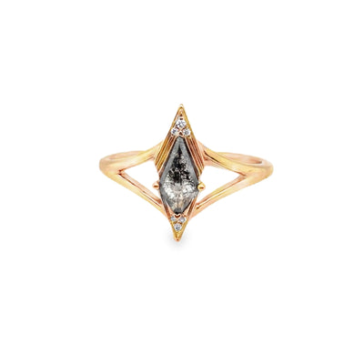 Gold ring with a central diamond and smaller diamonds on a white background